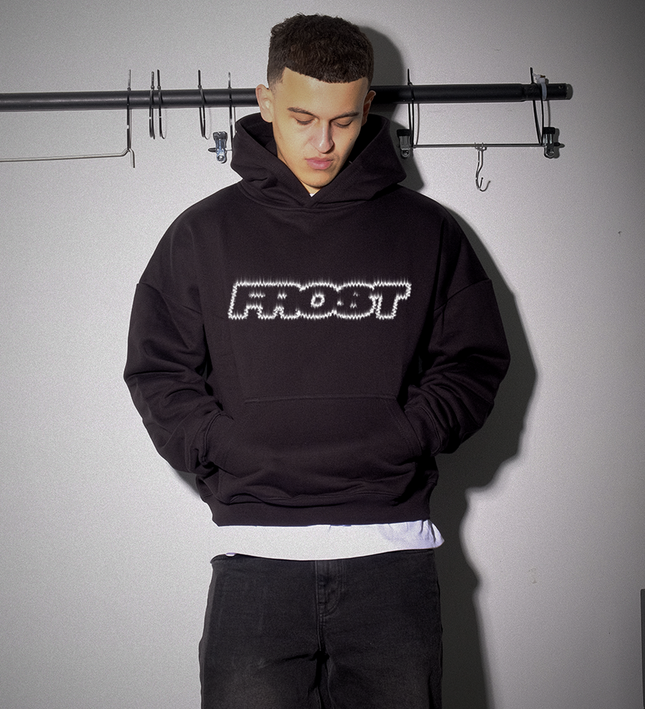 Black oversized boxy fit pullover hoodie named 'FLAME II Hoodie' featuring a fire inspired FROST logo print on the front. Made from 100% cotton, 500GSM heavyweight fabric, with a cropped & boxy fit.