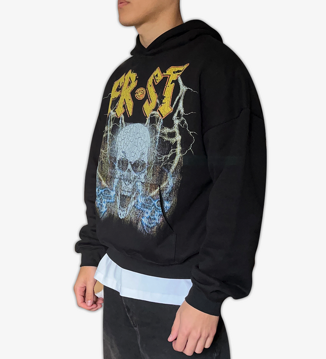 Black oversized boxy fit pullover hoodie named 'Rockstar Hoodie' featuring a vintage-inspired AC/DC-style graphic print on the front. Made from 100% cotton, 500GSM heavyweight fabric, designed to replicate classic band tee aesthetics