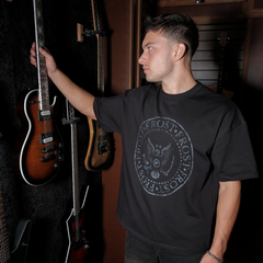 Black oversized boxy fit t-shirt named 'Establishment Tee' featuring a vintage-inspired Ramones-style graphic print on the front. Made from 100% cotton, 300GSM heavyweight fabric, designed to replicate classic band tee aesthetics