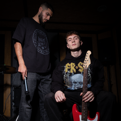 Black oversized boxy fit t-shirt named 'Establishment Tee' featuring a vintage-inspired Ramones-style graphic print on the front. Made from 100% cotton, 300GSM heavyweight fabric, designed to replicate classic band tee aesthetics
