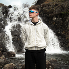 Frost clothing Grey and Green Marty Supreme Windbreaker. Made of crinkle nylon with waterproof properties.